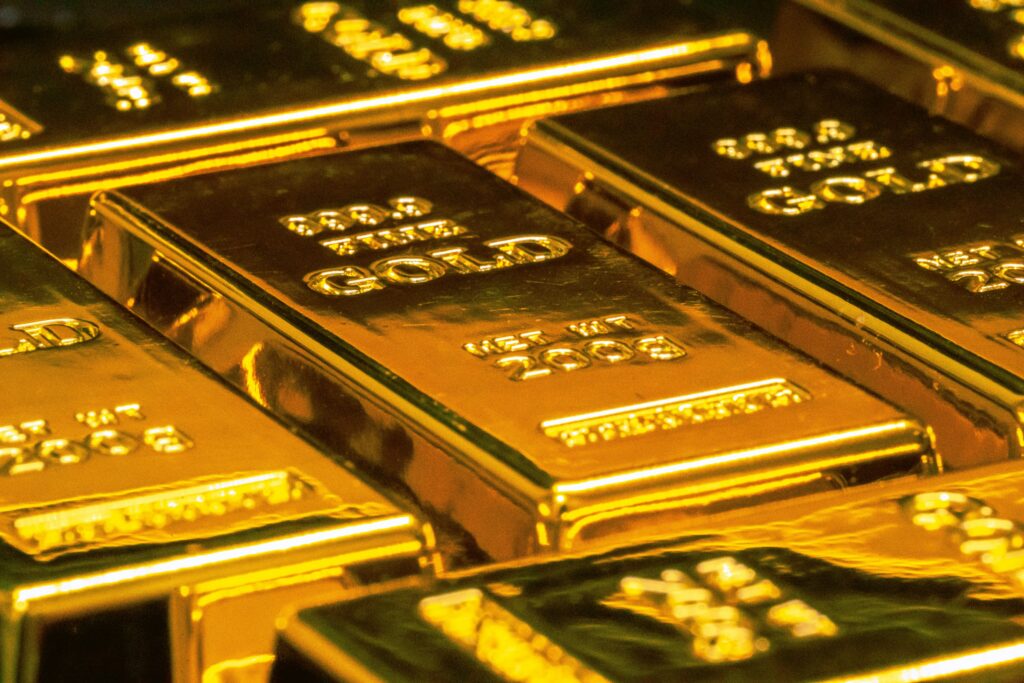 Stacks of shiny gold bars symbolizing business investment and financial assets in 2025